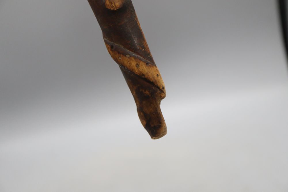 A carved fertility stick, c.1840, length 79cm